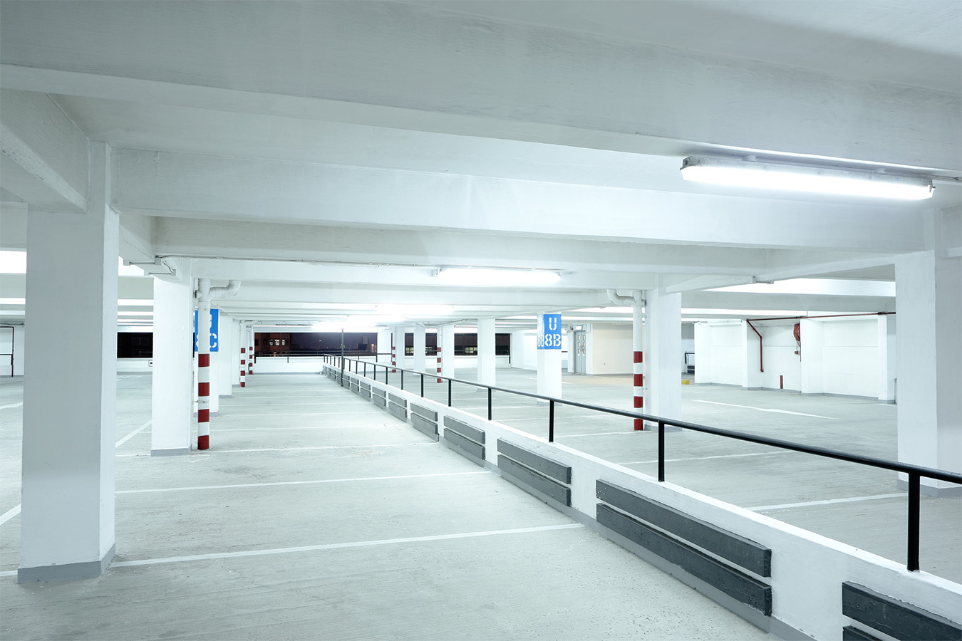 Empty well lit car park. white lights